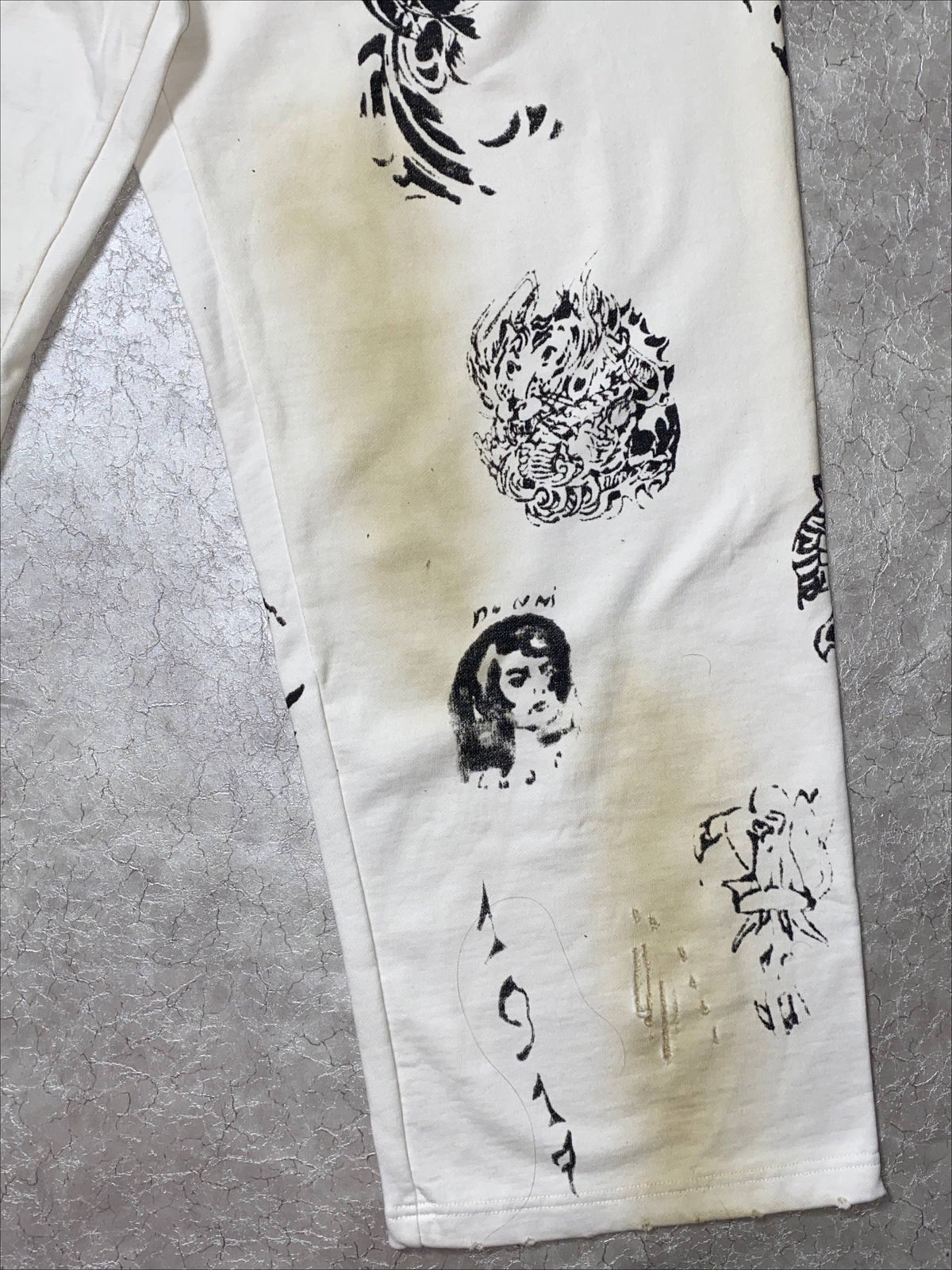 BALENCIAGA TATTO MUD DYED GRAFFITI PANTS
