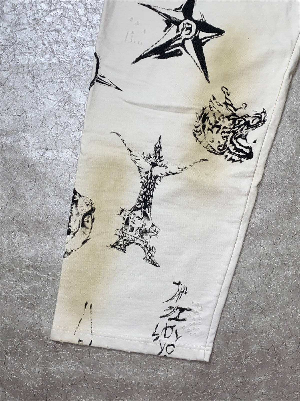 BALENCIAGA TATTO MUD DYED GRAFFITI PANTS